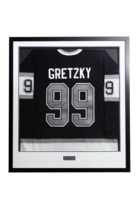 Custom framed hockey jersey on display in Richmond, BC – framing a jersey near me. Jersey framing, frame shop