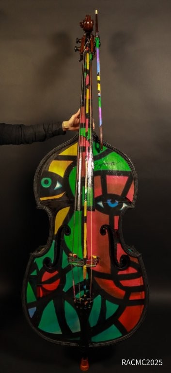 Joe Average painted cello artwork with colorful abstract faces – Resonance exhibition Capulet Art Gallery Richmond
